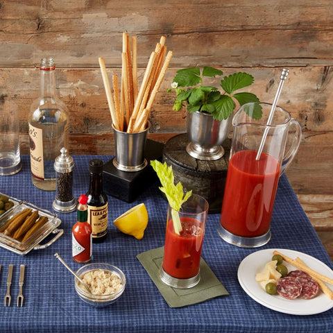 A Bloody Mary bar is set with MATCH Pewter glasses and accessories.