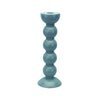 One tall blue colored bobbin shaped candlestick.