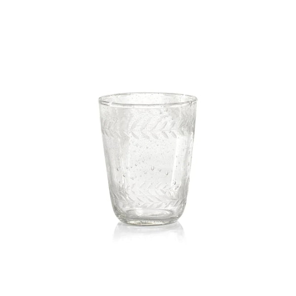 A single small tumbler features bubbles blown into the glass and vintage etching around the top and bottom rims. 