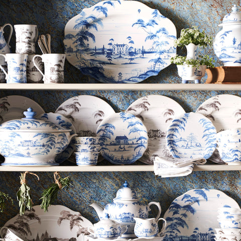Shelves full of Juliska's Country Estate dinnerware and serving pieces.