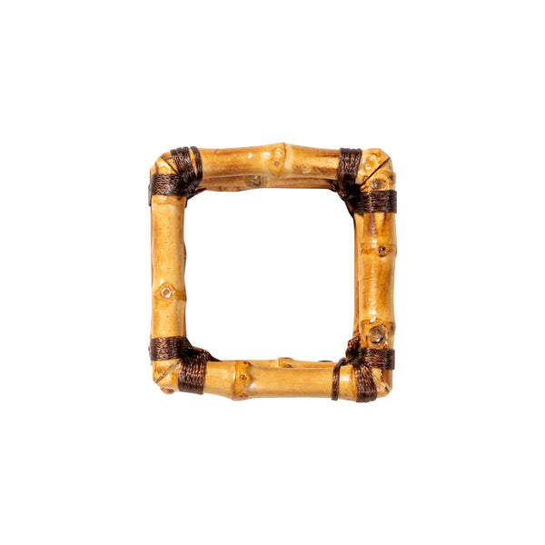 Overhead view of square, bamboo napkin ring on white background.