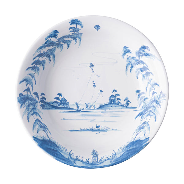 Inside view of Juliska's Country Estate Delft Blue 13" serving bowl. The design is of a family flying kites in a country field.