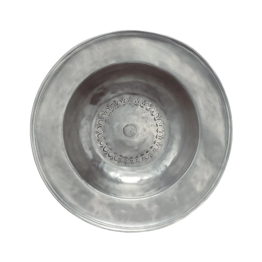 Match wide rimmed pewter bowl on white background. 