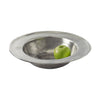 Match pewter wide rimmed bowl with green apple on white background. 