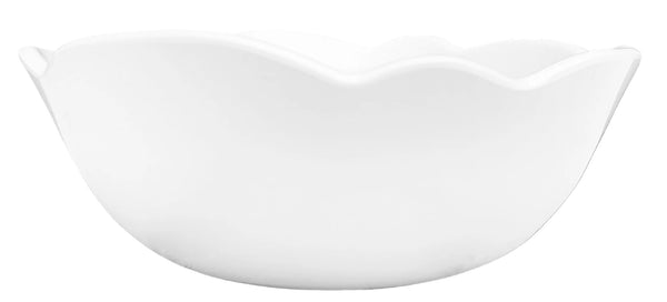 Scalloped, white melamine bowl on white background.