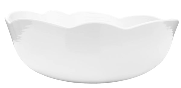 Scalloped, white melamine serving bowl on white background,.