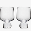 Two bourbon glasses on white background.