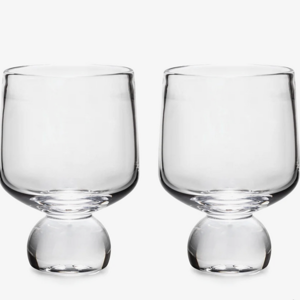 Two bourbon glasses on white background.