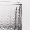 Detail of Simon Pearce Greenwich glass on white background.