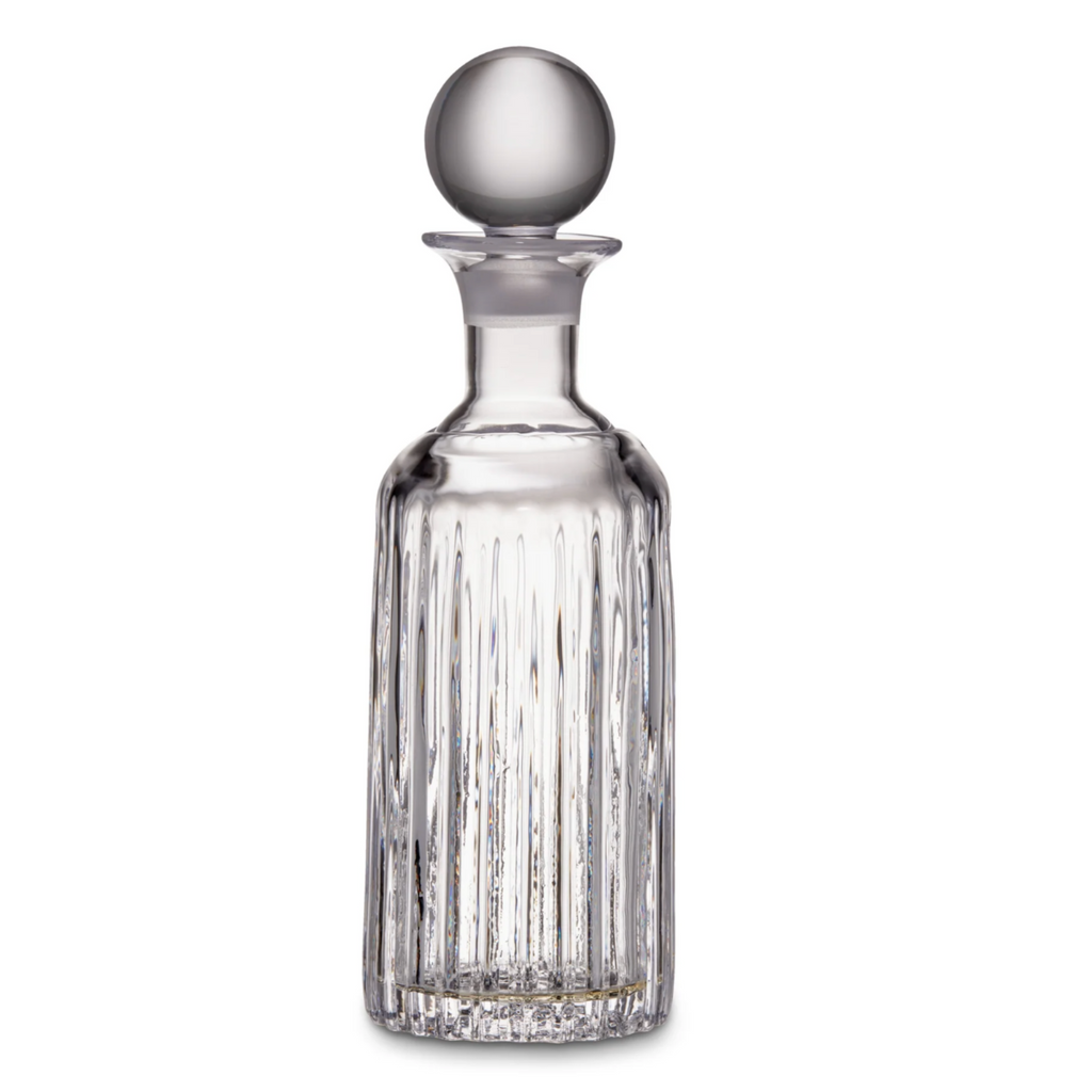 Hand cut glass decanter on white background.