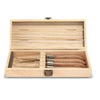 Wooden box of four steak knives with wooden handle on white background.