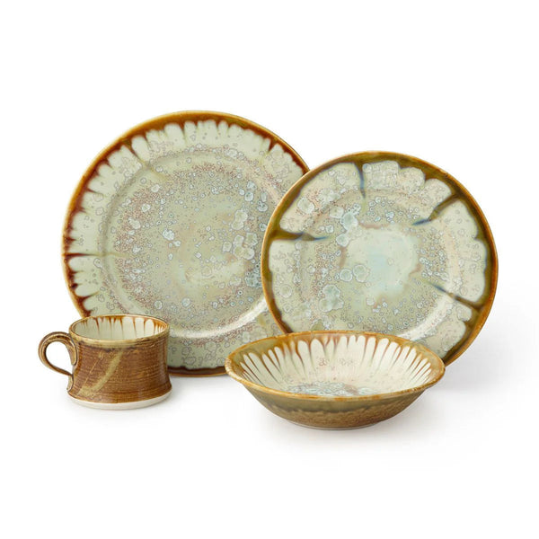 Alison Evans tortoise dinner plate, salad plate, mug and bowl on white background.