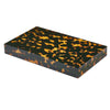Closed tortoiseshell backgammon case on white background.