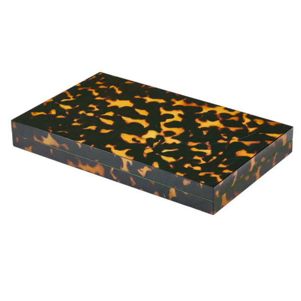 Closed tortoiseshell backgammon case on white background.