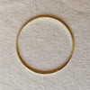 Gold filled bracelet on linen background.