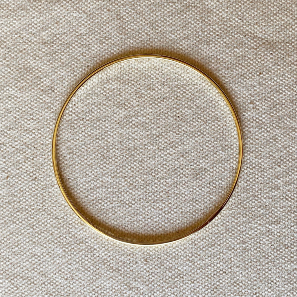 Gold filled bracelet on linen background.