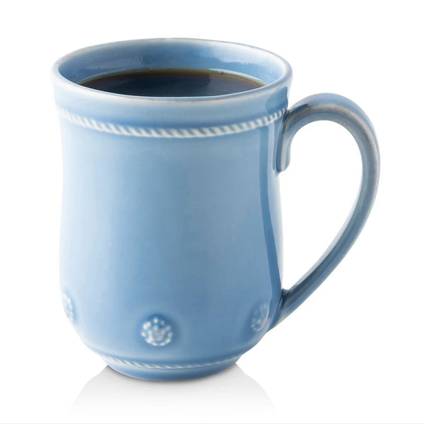 Chambray flared berry and thread mug filled with coffee on a white background.