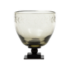 Decorative glass bowl with an iron base on a white background