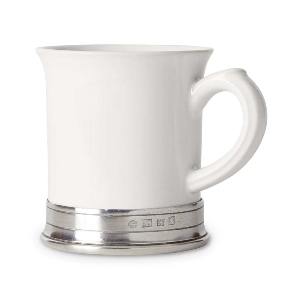 White ceramic mug with silver base on a white background