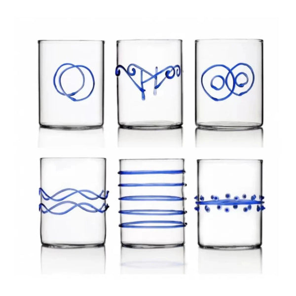 Set of six clear drinking glasses with blue deco designs on a white background.