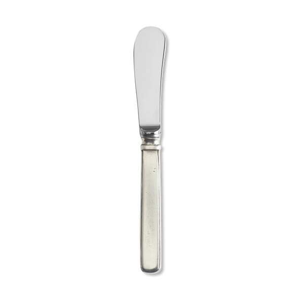 Pewter butter knife on white background.
