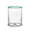 Clear glass tumbler with green rim on a white background