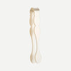 Acrylic tongs in ivory on white background.