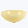 Yellow resin bowl on a white background
