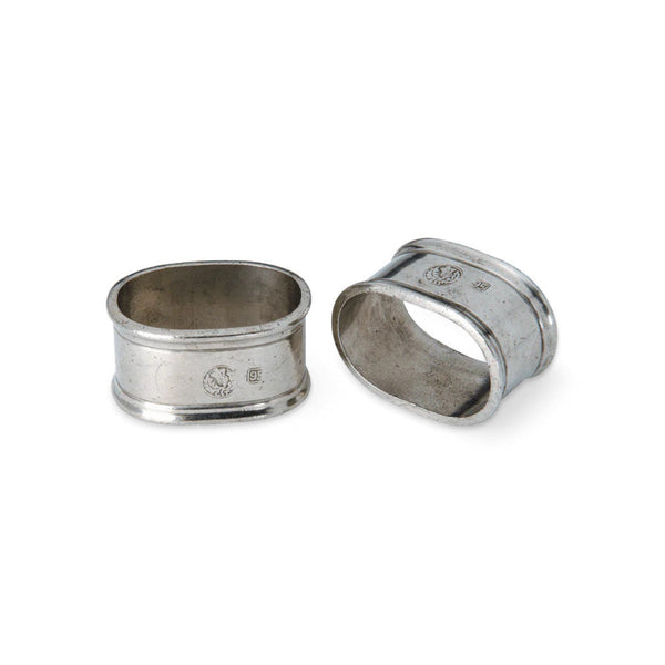 Two oval MATCH pewter napkin rings.