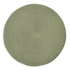 A round braided placemat in a muted sage green color, photographed from directly above on a solid white background.