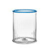 Clear rippled glass with blue rim on white background. 