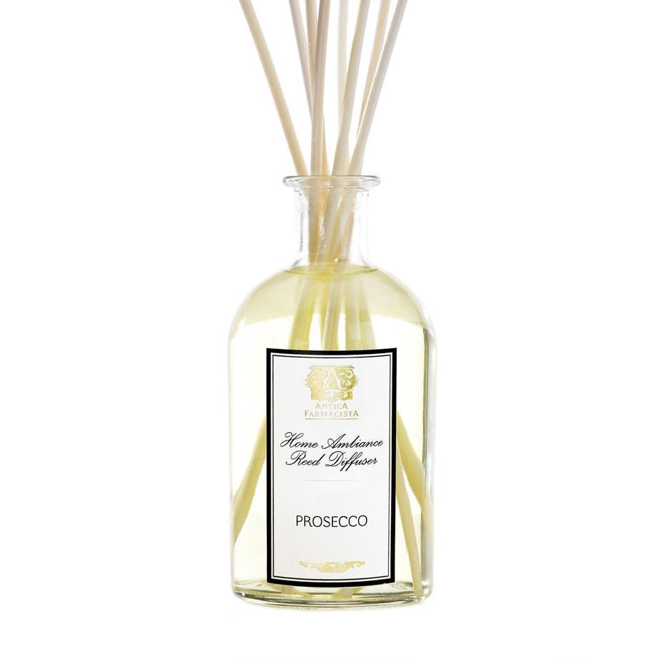 Prosecco scented diffuser with clear bottle and reeds.