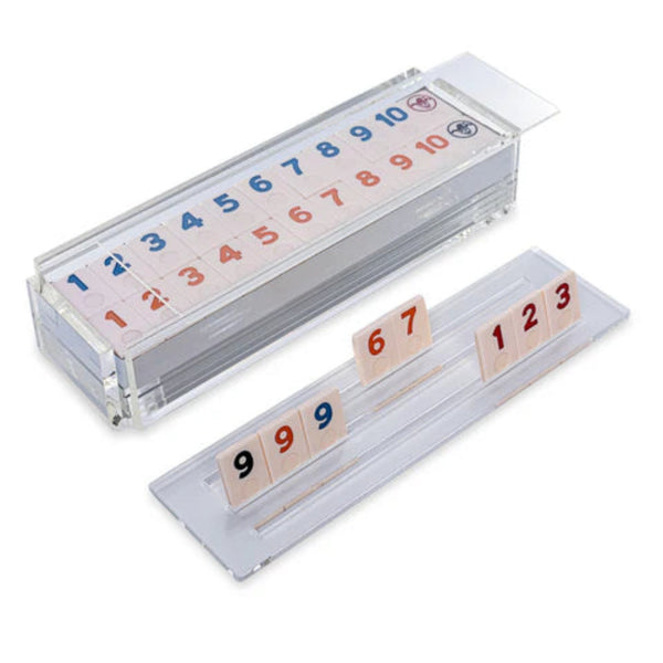Rumikub tile game in acrylic box on white background.