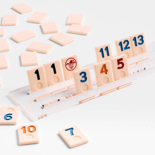 Detailed view of Rumikub tile game on white background.