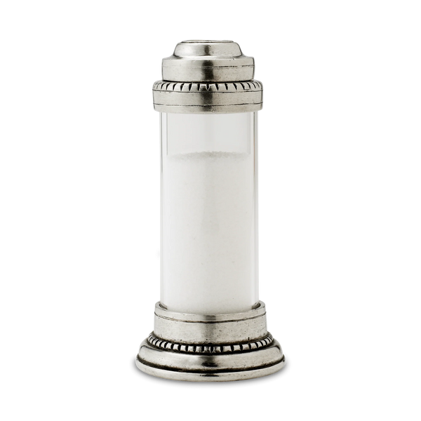 Pewter and glass salt shaker on white background.