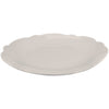 Scalloped melamine dinner plate in color stone on a white background.