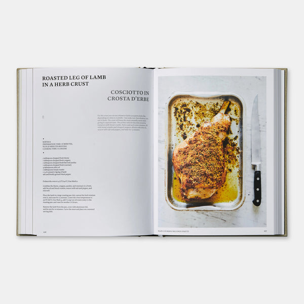 Recipe pages from the cookbook, The Silver Spoon Classic, describing how to cook Roasted Leg of Lamb in a Herb Crust, complete with a photograph of the complete meal.