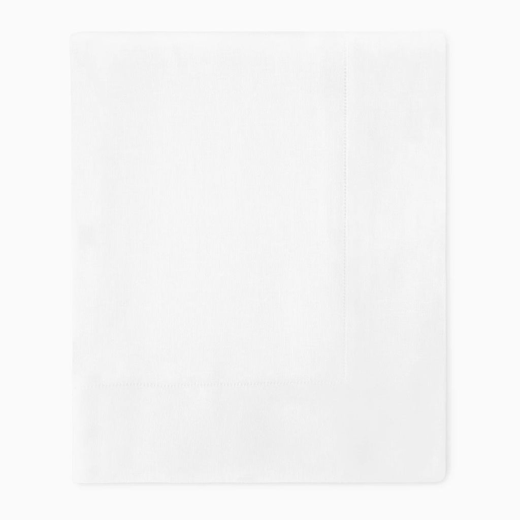 White linen folded tablecloth on white background. 