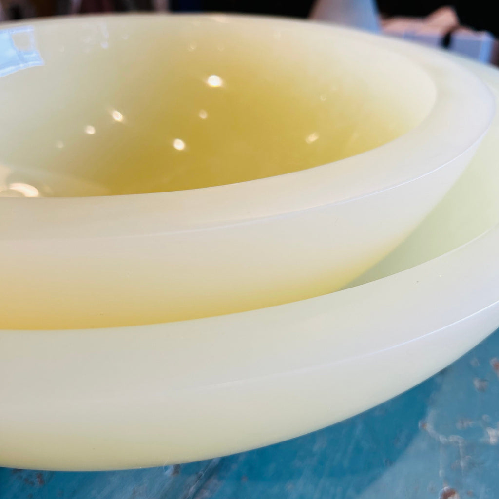 Close-up of a yellow resin bowls with a blurred background
