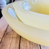 Clear resin bowl on a wooden surface