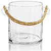 Clear glass ice bucket with rattan handle on white background.