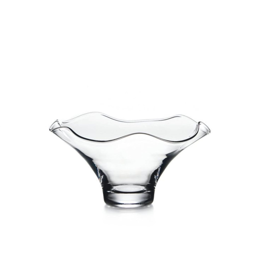 Medium Simon Pearce Chelsea bowl made of clear hand-blown glass with a narrow base and a wide wavy rim.