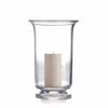 One extra large Simon Pearce Revere Hurricane with the included pillar candle inside. These clear glass candleholders are 13 inches tall and 8.25 inches wide and have a sturdy flared base and flared top.