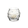 Simon Pearce's Waterbury tealight is clear glass and features a ripple design. Contains a votive candle.