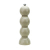 The Bobbin salt and pepper mill is shaped like three balls resting on top of each other. Made of Acacia wood and painted in fun colors and lacquered. This is a picture of a single mill in the color "cappuccino" (taupe). 