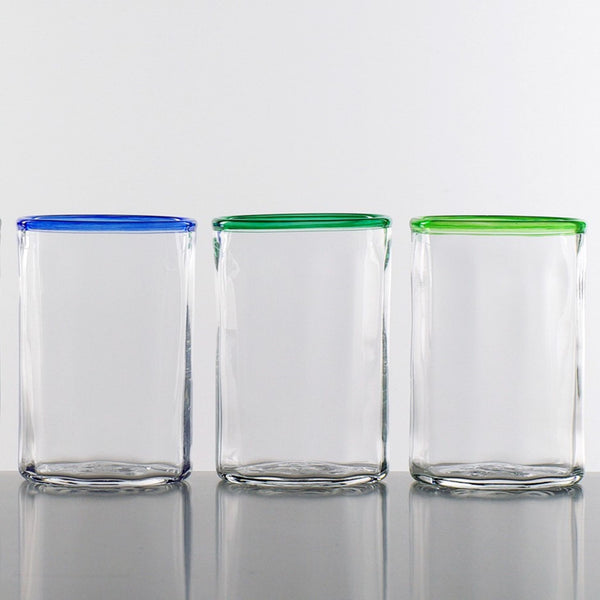 Three clear Lindean Mill short optic tumblers. with colored rims. One each in blue, green and light green.