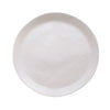 A cream round serving tray on a white background.